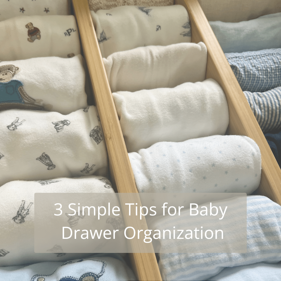 Organized baby drawer with dividers Organized baby drawer with drawer dividers and neatly folded baby essentials.
