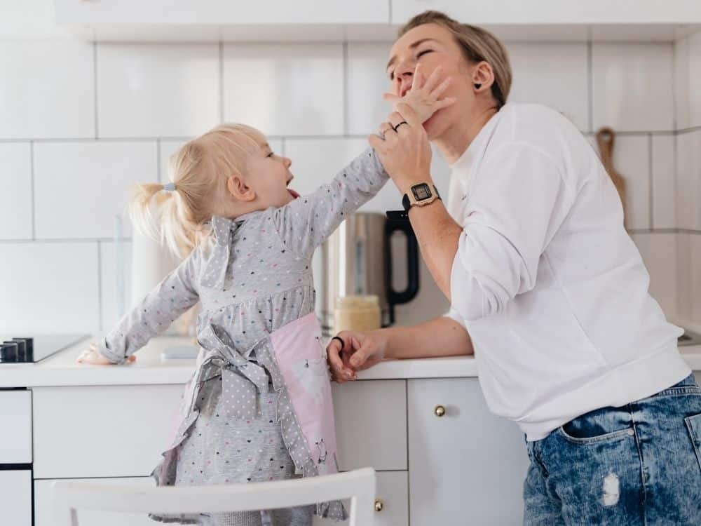 Mom enjoying time with her child because her home is decluttered and organized