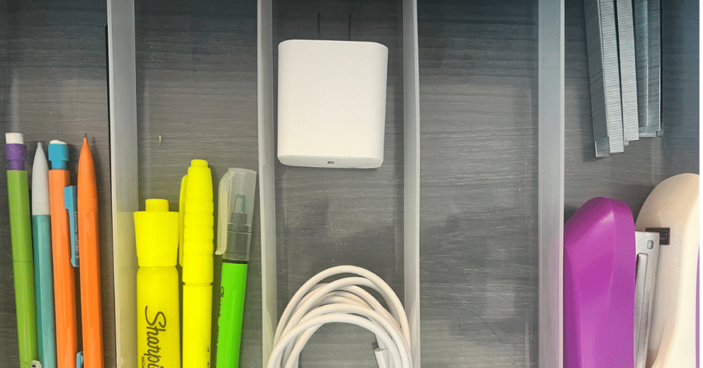 Office drawer with a drawer organizer that isn't completely filled, leaving breathing room.