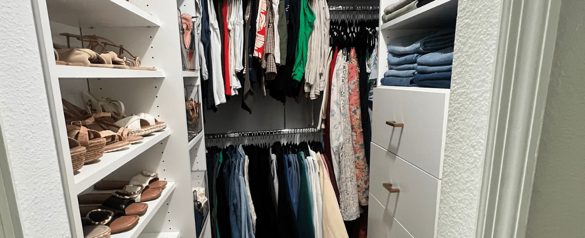 Small walk in closet after organization